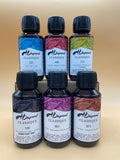 6 beginner silk dye bundle on a reflective surface with a gradient background.