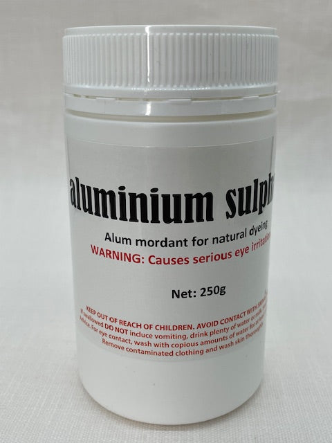 Aluminium sulphate container with text on a white background