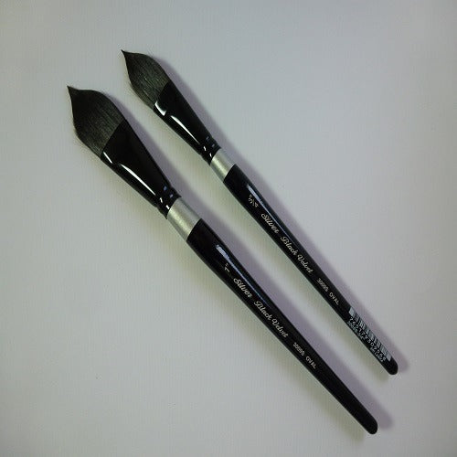 Two black paintbrushes with silver ferrules on a white background