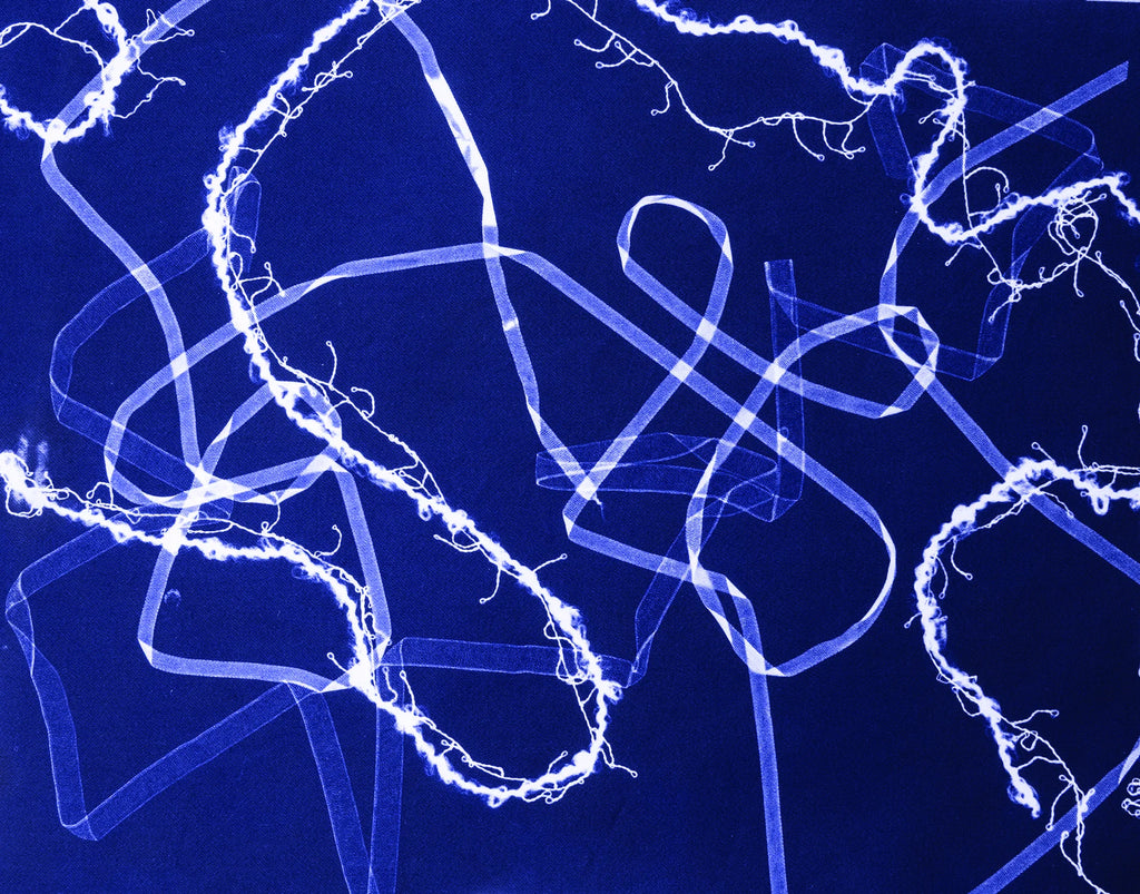 Abstract blue and white light patterns on a dark background