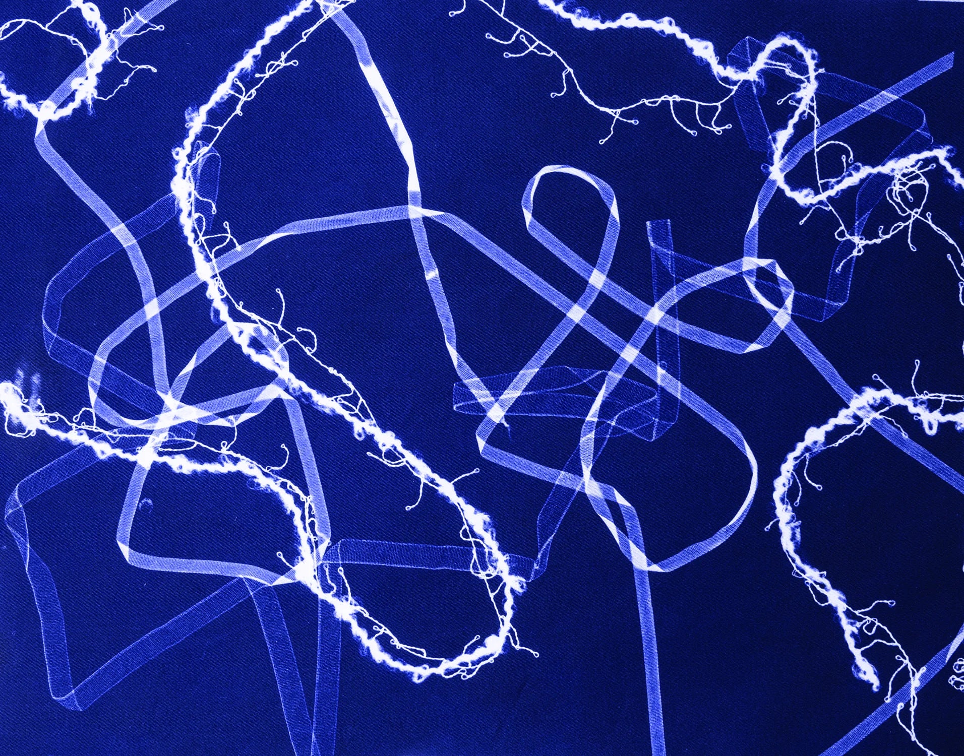 Abstract blue and white light patterns on a dark background