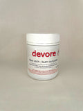 Devore fibre etch burn out paste container on a beige background