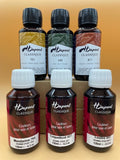 Six bottles of H Dupont Classique silk dyes on a gradient background