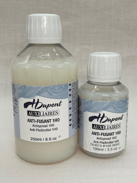 Two bottles of H Dupont Auxiliaries Anti-spread on a light gray background