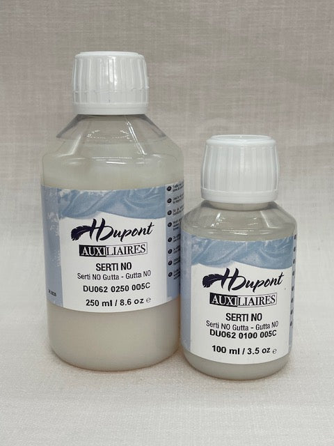 Two bottles of H Dupont clear gutta auxiliary products on a textured surface
