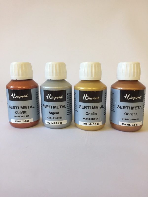 Four bottles of H Dupont Serti Metal paint on a white background