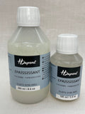 Two bottles of H Dupont Epaississant Thickener on a light gray background