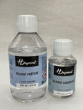 Two bottles of H Dupont diluents on a light gray background