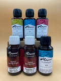 Six bottles of H Dupont silk dyes on a beige gradient background