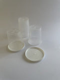 Clear plastic containers with lids on a white background