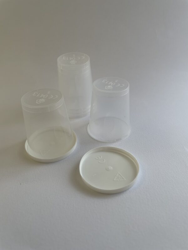 Clear plastic containers with lids on a white background