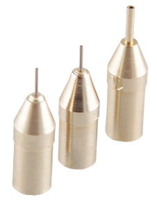 Set of three metallic nibs on a white background