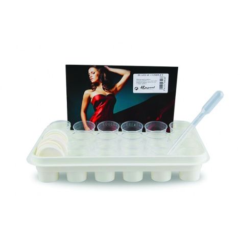 Tray with round cups and a dropper on a white background