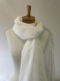 Undyed silk cotton scarf draped over a mannequin with a wooden head on a plain background