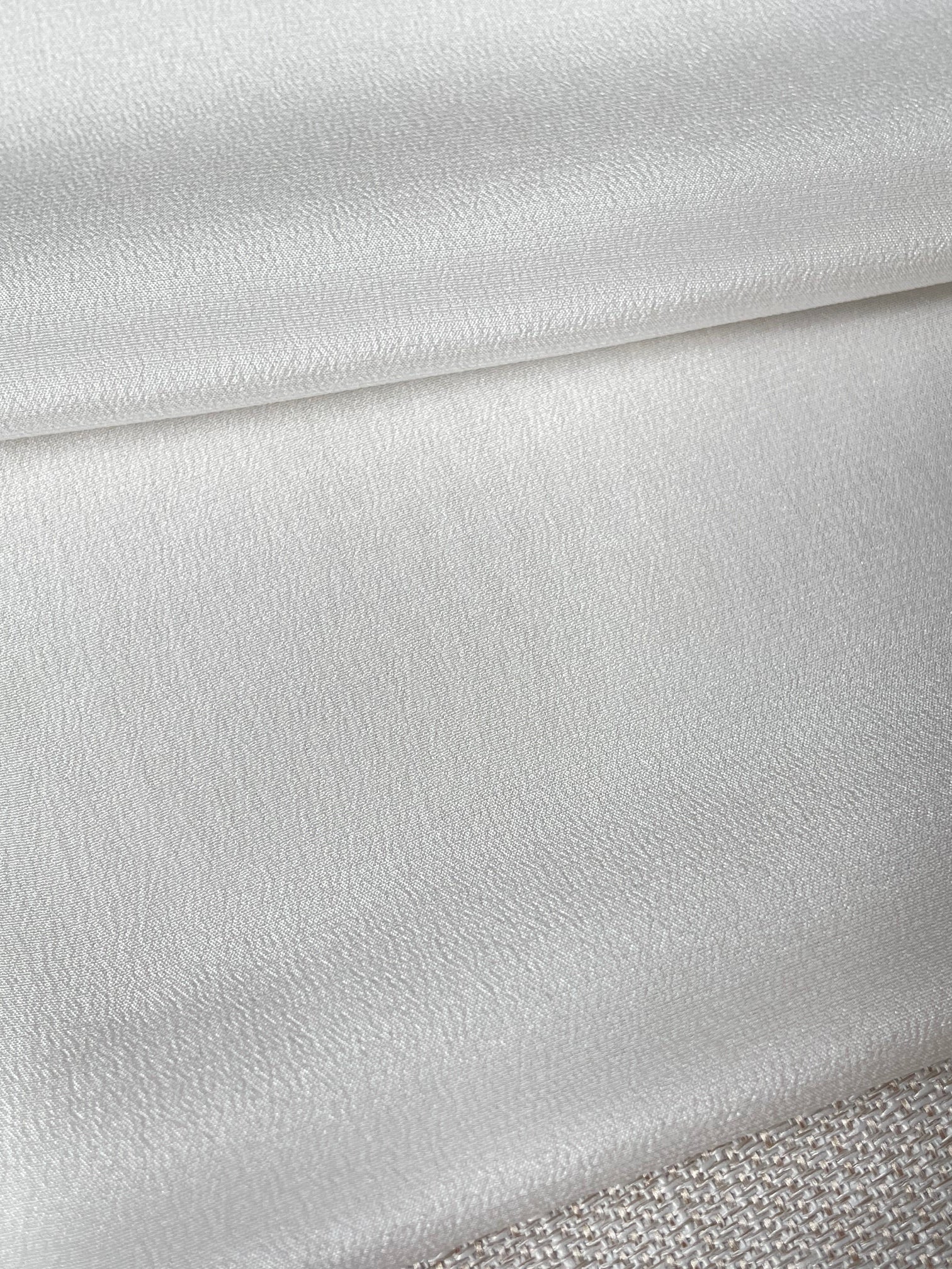 Close-up of textured undyed crepe de chine silk fabric