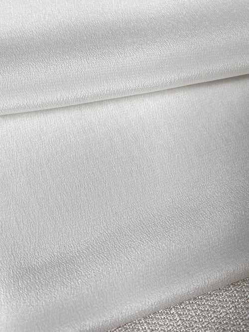 Close-up of textured undyed crepe de chine silk fabric