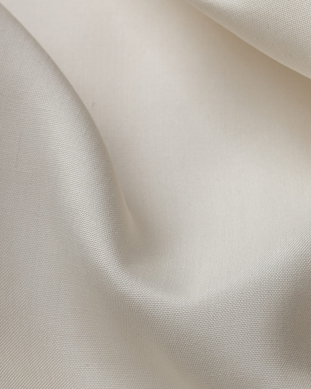 Close-up of undyed fuji spun silk fabric with a subtle texture