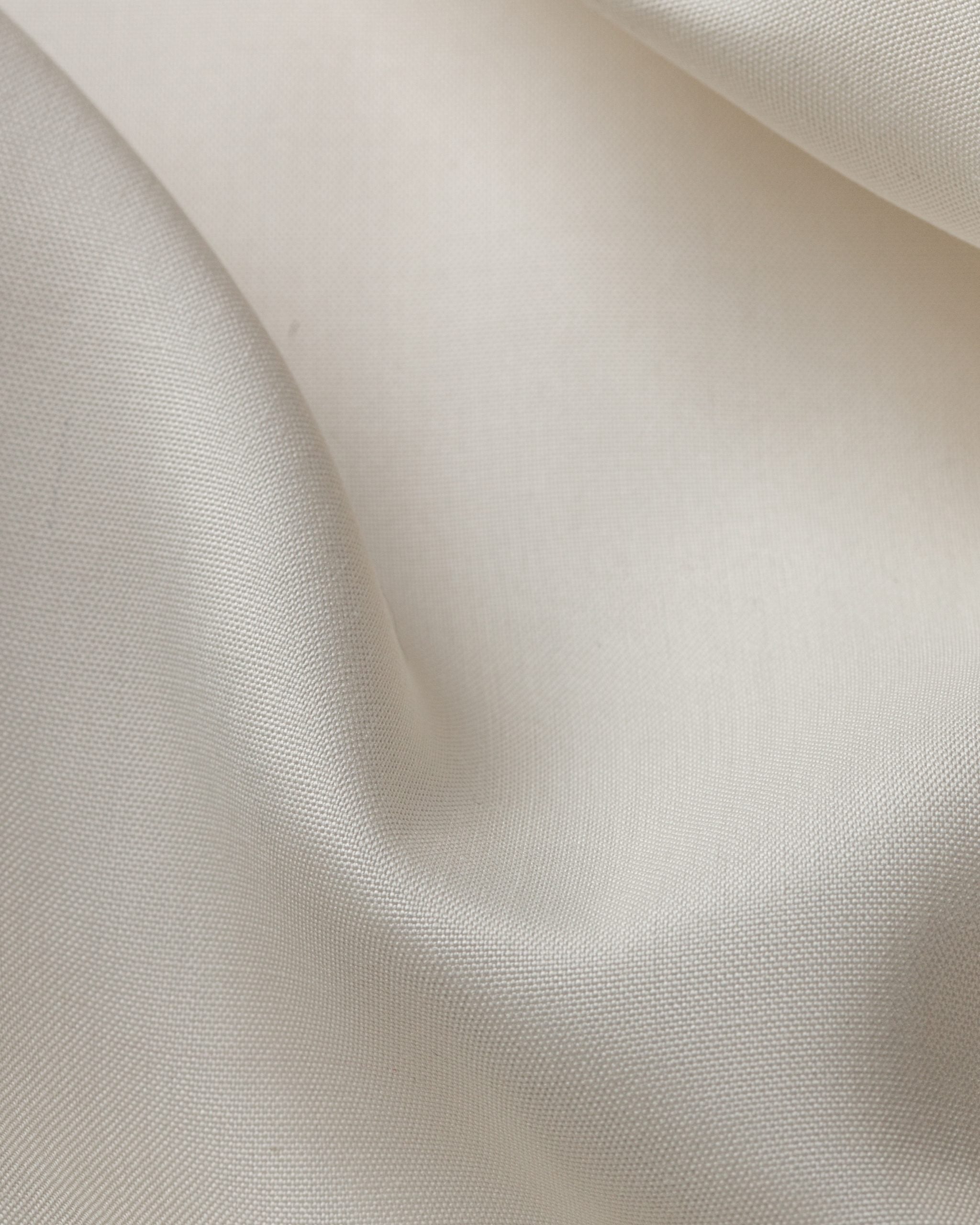 Close-up of undyed fuji spun silk fabric with a subtle texture