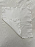Undyed Habutai silk square handkerchief with a corner folded over on a matching background
