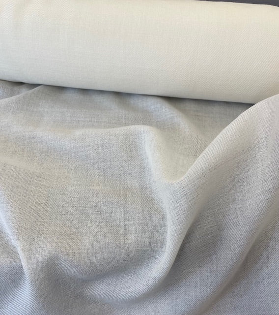 Close-up of undyed lightweight wool fabric on a roll