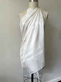 Undyed Paj silk sarong draped over a mannequin on a plain background