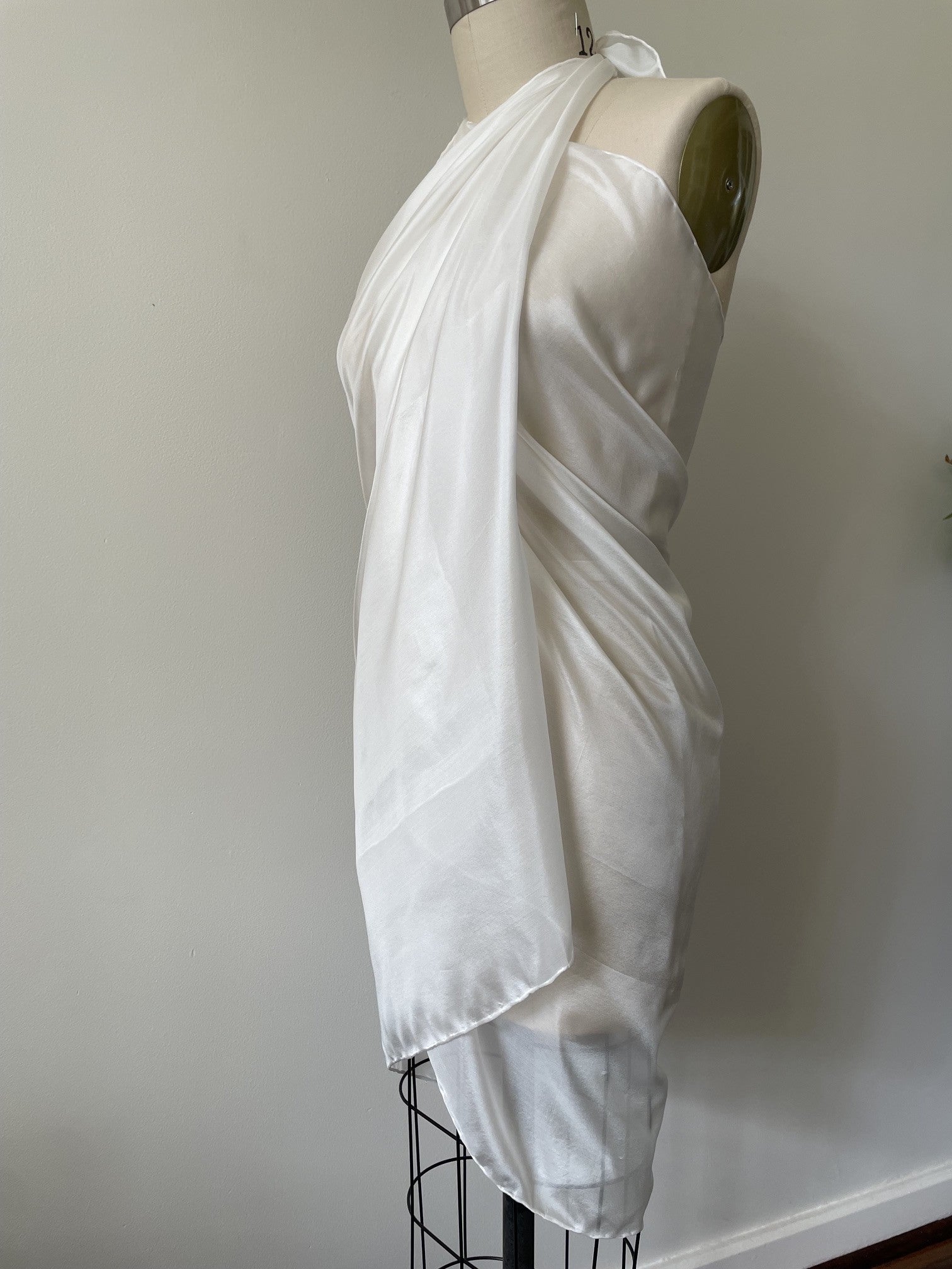 Undyed Paj silk sarong on a mannequin against a plain background