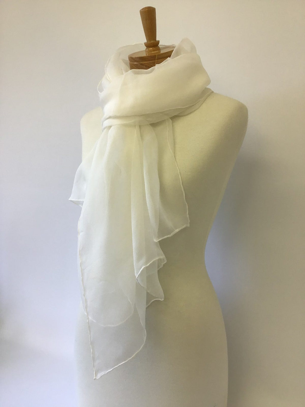 Undyed Silk Gauze scarf draped over a mannequin against a plain background