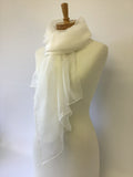 Undyed Silk Gauze scarf draped over a mannequin against a plain background