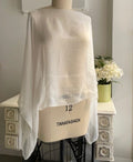Undyed silk chiffon sheer top on a mannequin against a neutral background