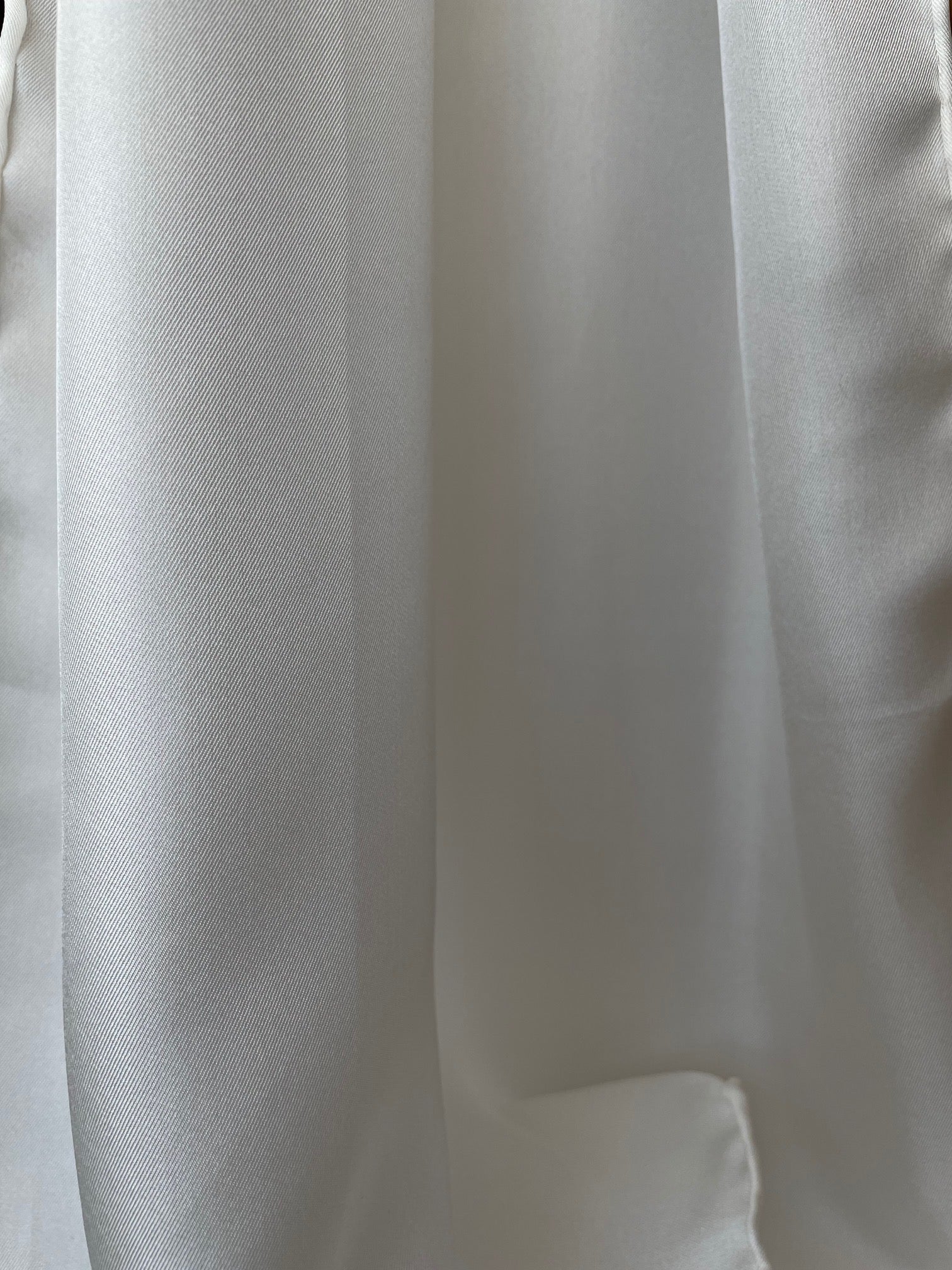 Close-up of undyed silk twill textured fabric