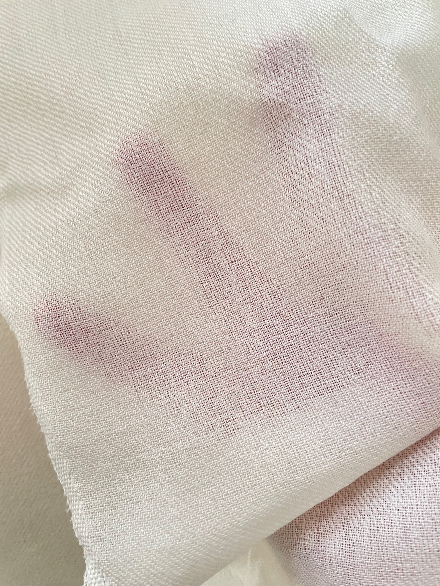 Close-up of textured undyed wool fabric 